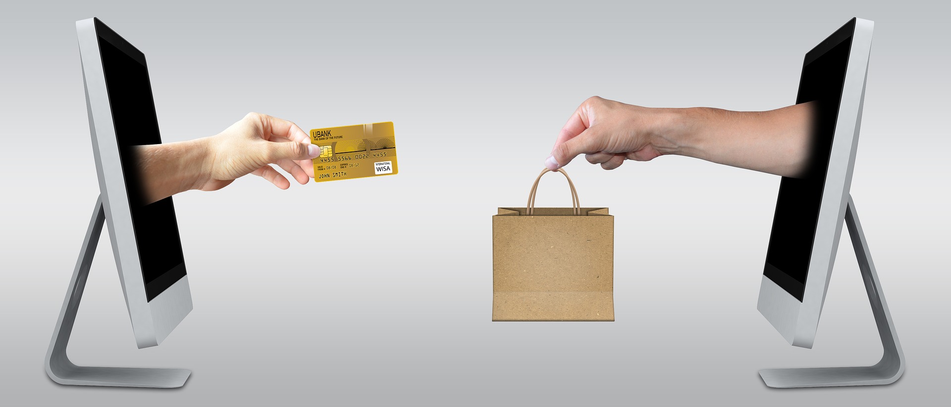 Ecommerce icons credit card and shopping bag leaping out from computer screens